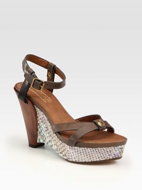 Burnished leather silhouette with an adjustable ankle strap set atop a wooden and python-covered wedge. Python and wooden wedge, 4 (100mm)Python-covered platform, 1 (25mm)Compares to a 3 heel (75mm)Leather and python upperLeather lining and solePadded insoleMade in ItalyOUR FIT MODEL RECOMMENDS ordering true size. Burnished leather silhouette with an adjustable ankle strap set atop a wooden and python-covered wedge. Python and wooden wedge, 4 (100mm)Python-covered platform, 1 (25mm)Compares to a 3 heel (75mm)Leather and python upperLeather lining and solePadded insoleMade in ItalyOUR FIT MODEL RECOMMENDS ordering true size.