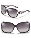 Large oversized sunglasses with with circular open metal temples for a glamorous touch.