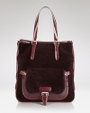 Unexpected details and contrasting textures update this classically styled tote from Longchamp.