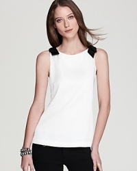 The classic white shirt gets a charming update as dainty bows adorn the shoulders of this silk Vineyard Vines top. It's playful and polished all at once. The classic white shirt gets a charming update as dainty bows adorn the shoulders of this silk Vineyard Vines top. It's playful and polished all at once.