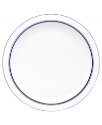 Named for a trendy Copenhagen neighborhood but designed with timeless style, the Christianshavn Blue bread and butter plate features a double band of navy in pristine white porcelain. From Dansk.