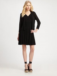 A softly ribbed open-front sweater that offers lightweight coziness and immense style.Open-front designThree-quarter sleevesAbout 31 from shoulder to hem84% viscose/16% nylonDry cleanImported of Italian fabric Model shown is 5'10 (177cm) wearing US size Small. A softly ribbed open-front sweater that offers lightweight coziness and immense style.Open-front designThree-quarter sleevesAbout 31 from shoulder to hem84% viscose/16% nylonDry cleanImported of Italian fabric Model shown is 5'10 (177cm) wearing US size Small.