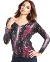 An abstract print adds graphic color to this GUESS sweater -- a hot layering piece!