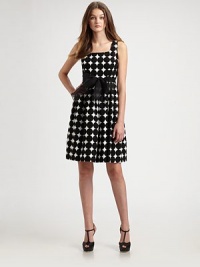 A bold, graphic dot pattern and a wide organza sash decorate this full-skirted cotton style.U necklineSleevelessOrganza waist tieFull shirred skirtConcealed back zipFully linedAbout 23 from natural waistCottonDry cleanMade in USAModel shown is 5'10 (177cm) wearing US size 2. A bold, graphic dot pattern and a wide organza sash decorate this full-skirted cotton style.U necklineSleevelessOrganza waist tieFull shirred skirtConcealed back zipFully linedAbout 23 from natural waistCottonDry cleanMade in USAModel shown is 5'10 (177cm) wearing US size 2.