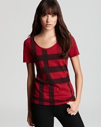 From the arbiters of cool comes a classic Burberry Brit tee, featuring a strikingly oversized version of the iconic check print for serious fashion presence. From the arbiters of cool comes a classic Burberry Brit tee, featuring a strikingly oversized version of the iconic check print for serious fashion presence.