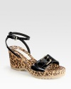 A leopard-print cork wedge adds feline-inspired style to this faux patent design. Cork wedge, 3 (75mm)Cork platform, 1 (25mm)Compares to a 2 heel (50mm)Faux patent leather upperAdjustable strapsFaux leather liningRubber solePadded insoleMade in Spain