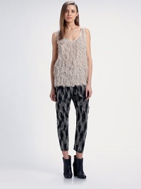 Playful feathered trim decorates the front of this versatile pullover piece.ScoopneckSleevelessFeathered frontFully lined 80% polyester/12% silk/8% nylonDry cleanMade in USA of imported fabricModel shown is 5'10 (177cm) wearing US size 4. Playful feathered trim decorates the front of this versatile pullover piece.ScoopneckSleevelessFeathered frontFully lined 80% polyester/12% silk/8% nylonDry cleanMade in USA of imported fabricModel shown is 5'10 (177cm) wearing US size 4.