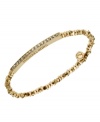 Stackable styles a must! Michael Kors' chic stretch bracelet pairs perfectly with bangles or bracelets. Beads and bar accent are crafted in gold tone mixed metal and accented by pave-set glass accents. Approximate diameter: 2-1/4 inches. Approximate width: 1/8 inch.