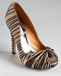Badgley Mischka makes a striped statement with the Ryba pumps, boasting a flocked texture and a knotted peep toe. Badgley Mischka makes a striped statement with the Ryba pumps, boasting a flocked texture and a knotted peep toe.