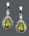 The perfect August birthday present. Pear-cut peridots (7/8 ct. t.w.) pop in these stunning drop earrings. Crafted in 14k gold and sterling silver with sparkling diamond accents. Approximate drop: 1 inch.