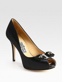 A rhinestone-encrusted bow adds sparkle to this peep toe silhouette in luxurious Italian satin. Self-covered heel, 3¾ (95mm)Hidden platform, ¾ (20mm)Compares to a 3 heel (75mm)Satin upper and beaded rhinestone-encrusted detailPeep toeLeather lining and solePadded insoleMade in Italy A rhinestone-encrusted bow adds sparkle to this peep toe silhouette in luxurious Italian satin. Self-covered heel, 3¾ (95mm)Hidden platform, ¾ (20mm)Compares to a 3 heel (75mm)Satin upper and beaded rhinestone-encrusted detailPeep toeLeather lining and solePadded insoleMade in Italy