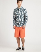 A pure vision of summer in breezy cotton with a photo-real iris print blooming allover. ButtonfrontChest patch pocketCottonDry cleanMade in USA