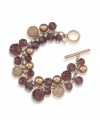 Gorgeous and glittering. Rich brown glass beads, golden glass pearls and sparkling charms embellish Carolee's cluster bracelet. With a secure toggle closure, it's crafted in gold tone mixed metal. Approximate length: 8 inches.