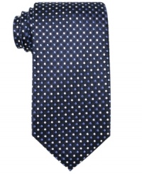 With a subtly refined pattern, this Tasso Elba tie stands out against a solid dress shirt. With a subtly refined pattern, this Tasso Elba tie stands out against a solid dress shirt.