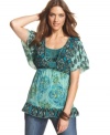 Flutter sleeves and a ruffled hem make this Style&co. top sublimely feminine. Pair with jeans for breezy summer style.