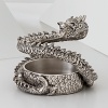 The grand form of a mythical dragon was the muse behind this sculptural hand-cast wine coaster from Natori.