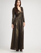 Shimmering, floor-length gown with a ruched silhouette and flattering Empire waist. Gathered v-neckRuched empire waistLong sleevesInvisible back zipperAbout 45 from natural waistFully lined92% polyester/8% spandexDry cleanMade in USA of imported fabric