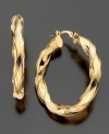 Fabulous textured twists make these 14k gold earrings a fashionable success. Approximate diameter: 1 inch.