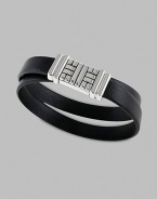 A double-wrapped strap of premium leather is interrupted by a basketwoven silver clasp. From the Bedeg Collection Leather Silver About 7 diam. Magnetic pusher clasp Imported 