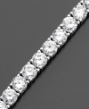 Grace your wrist with a never-ending circle of beautiful round-cut cubic zirconias (10 ct. t.w.). This tennis bracelet by CRISLU is set in sterling silver finished in platinum. Approximate length: 7 inches.