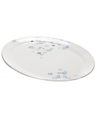 Breezy florals scatter on the white bone china of this Water Blossoms oval platter, suffusing your table with effortless grace. With shimmering platinum petals and banding for an especially pretty table. From Martha Stewart Collection. Breezy florals scatter on the white bone china of this Water Blossoms oval platter, suffusing your table with effortless grace. With shimmering platinum petals and banding for an especially pretty table. From Martha Stewart Collection.