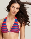 In a punchy palette, this boldly striped DKNY bikini top looks trend-right with a rope-handled beach tote and low-key espadrilles.