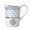 Carefully rendered in a style reminiscent of neoclassic trompe l'oeil-a French term for artwork that depicts optical illusions-a captivating geometric rosette motif traverses this elegant porcelain creamer from Bernardaud. Delicate shades of ice blue, mother-of-pearl and gray are enhanced by a fine platinum trim and medallion design.