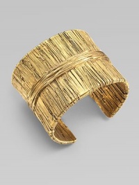 Richly textured with an organic look, this golden cuff has the sculptural appearance of wrapped and tied threads.GoldplatedDiameter, about 2¼Width, about 2Made in France Richly textured with an organic look, this golden cuff has the sculptural appearance of wrapped and tied threads.GoldplatedDiameter, about 2¼Width, about 2Made in France