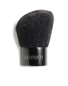 A black goat hair, kabuki-style brush with severely rounded edges and a gently cut angled head allowing for fuller coverage on the planes of the face. Ideally used with the Mineral Powder SPF 15 as well as other powder formulations. Pick up powder on the slanted face, tap off excess and buff into the skin. 
