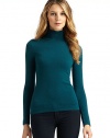 THE LOOKLuxe 2-ply cashmere from expertly maintained inner Mongolian cashmere goatsFeatures long, fine, smooth fibers top-dyed for maximum color saturationRibbed turtleneckRibbed cuff cap sleeves Ruched sidesRibbed hemTHE FITAbout 21 from shoulder to hemTHE MATERIALCashmereCARE & ORIGINDry cleanImportedModel shown is 5'10 (177cm) wearing US size Small. 