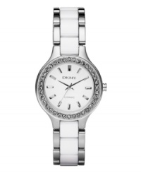 A sleek silhouette and simple details make a big impact. Watch by DKNY crafted of stainless steel bracelet with center links of white ceramic and round case. Bezel embellished with clear crystal accents. White dial features silver tone stick indices, three hands and logo. Quartz movement. Water resistant to 50 meters. Two-year limited warranty. A sleek silhouette and simple details make a big impact. Watch by DKNY crafted of stainless steel bracelet with center links of white ceramic and round case. Bezel embellished with clear crystal accents. White dial features silver tone stick indices, three hands and logo. Quartz movement. Water resistant to 50 meters. Two-year limited warranty.