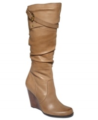 Buttery soft with the perfect amount of texture. GUESS's Mally wedge boots feature wrap-around strap detail and an inside zipper. Buttery soft with the perfect amount of texture. GUESS's Mally wedge boots feature wrap-around strap detail and an inside zipper.