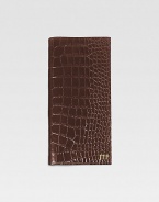 A travel essential crafted of crocodile-embossed Italian calfskin, this handsome design has a ticket compartment, six credit card slots and one slot for passport. Keeps all travel papers organized and handy About 3½ X 9¼ Made in USAFOR PERSONALIZATIONSelect a color and quantity, then scroll down and click on PERSONALIZE & ADD TO BAG to choose and preview your personalization options. Please allow 1 week for delivery.