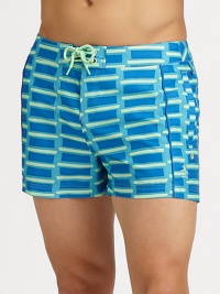 A sleek, form-fitting look with pieced construction and brilliant color that revives a classic beach style. Drawstring waistSide, back pocketsMesh liningInseam, about 3PolyesterMachine washImported A sleek, form-fitting look with pieced construction and brilliant color that revives a classic beach style. Drawstring waistSide, back pocketsMesh liningInseam, about 3PolyesterMachine washImported