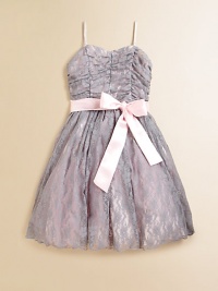 A delicate lace overlay and charming sash tie lend sweet princess style to this dreamy frock.Sweetheart necklineAdjustable shoulder strapsConcealed back zipperWaistband with sash tieFull skirt with tulle underlayFully linedNylon/polyester/spandexDry cleanMade in the USA A delicate lace overlay and charming sash tie lend sweet princess style to this dreamy frock.Sweetheart necklineAdjustable shoulder strapsConcealed back zipperWaistband with sash tieFull skirt with tulle underlayFully linedNylon/polyester/spandexDry cleanMade in the USA