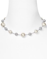 Simple and elegant. Carolee's silver-plated illusion necklace will perfect a polished look when worn beneath a crisp white blouse or over a bare neckline. Simple and elegant. Carolee's silver-plated illusion necklace will perfect a polished look when worn beneath a crisp white blouse or over a bare neckline.