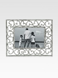 Finding inspiration from the imagery that floats around classic storytelling, this charming frame is crafted from hand-forged, nickel-plated metal by one of America's premier metalwork artists. From the Heart CollectionArrives in a gift box for giving or storingImportedDIMENSION INFORMATION4 X 6 (7¾ X 9½ overall)5 X 7 (8¾ X 10½ overall)8 X 10 (11¾ X 13½ overall) Finding inspiration from the imagery that floats around classic storytelling, this charming frame is crafted from hand-forged, nickel-plated metal by one of America's premier metalwork artists. From the Heart CollectionArrives in a gift box for giving or storingImportedDIMENSION INFORMATION4 X 6 (7¾ X 9½ overall)5 X 7 (8¾ X 10½ overall)8 X 10 (11¾ X 13½ overall)