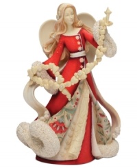 Spread joy throughout your home with this beautifully detailed angel figurine. With a floral design upon her robe, a sweet garland of hearts and snowflakes and crystal accents, she's sure to light up your holiday season. Spread joy throughout your home with this beautifully detailed angel figurine. With a floral design upon her robe, a sweet garland of hearts and snowflakes and crystal accents, she's sure to light up your holiday season.