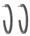 Gray matters. A black platinum finish adds depth and drama to CRISLU's chic hoop earrings. Crafted in sterling silver with an inside out design, they're adorned with glittering black cubic zirconias (1/2 ct. t.w.). Wear them day or night for a gorgeous, glamorous look. Approximate diameter: 15/16 inch.