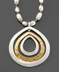 A subtly glamorous necklace inspired by natural motifs. From Kenneth Cole New York, this two tone mixed metal necklace features a fashionable teardrop shaped ringed pendant that hangs from a metal stone 18-inch chain. Comes with a 3-inch extender. A subtly glamorous necklace inspired by natural motifs. From Kenneth Cole New York, this two tone mixed metal necklace features a fashionable teardrop shaped ringed pendant that hangs from a metal stone 18-inch chain. Comes with a 3-inch extender.