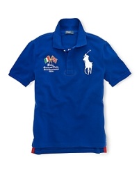 A preppy short-sleeved polo shirt in breathable cotton mesh is accented with country embroidery. A preppy short-sleeved polo shirt in breathable cotton mesh is accented with country embroidery.