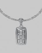 Polished silver with a military mind, crafted in a dogtag design with the look of laticework. From the Bedeg Collection Sterling silver Chain necklace 1W X 2¼L Lobster clasp Made in Bali 