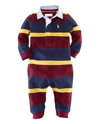 A preppy long-sleeved coverall is rendered in boldly striped cotton mesh. A preppy long-sleeved coverall is rendered in boldly striped cotton mesh.