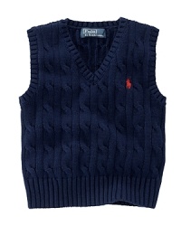 The essential sweater vest is a handsome layer rendered in durable cable-knit cotton. The essential sweater vest is a handsome layer rendered in durable cable-knit cotton.