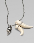 Swarovski crystal accented skull and tusk-shaped pendants on a link chain. BrassSwarovski crystalsLength, about 27Pendant size, about 2 and 1½ Lobster clasp closureMade in Italy