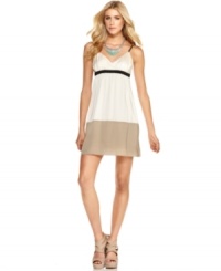 Neutral tones are contrasted by dark accents on an empire-waist dress from Kensie that's colorblock du jour! Neutral tones are contrasted by dark accents on an empire-waist dress from Kensie that's colorblock du jour!