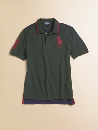 A classic cotton polo shirt is updated with color-blocking details for a modern look.Polo collarShort sleevesButton-frontUneven vented hemCottonMachine washImported Please note: Number of buttons may vary depending on size ordered. A classic cotton polo shirt is updated with color-blocking details for a modern look.Polo collarShort sleevesButton-frontUneven vented hemCottonMachine washImported Please note: Number of buttons may vary depending on size ordered.