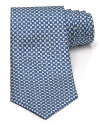 A silk tie adds distinction and flair to your formal presentation. With a repeating pattern of elephants, you'll also punch up your attire with a bit of wit. A silk tie adds distinction and flair to your formal presentation. With a repeating pattern of elephants, you'll also punch up your attire with a bit of wit.
