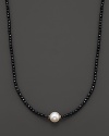 Black onyx beaded necklace with a single freshwater pearl.