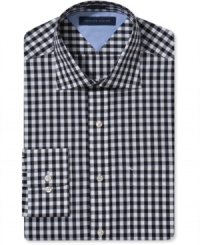 Classic gingham on this slim-fit Tommy Hilfiger dress shirt adds a punch of pattern to your everyday business look.